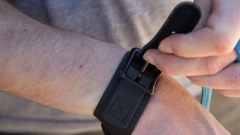 Buckle system on a wrist strap archery release