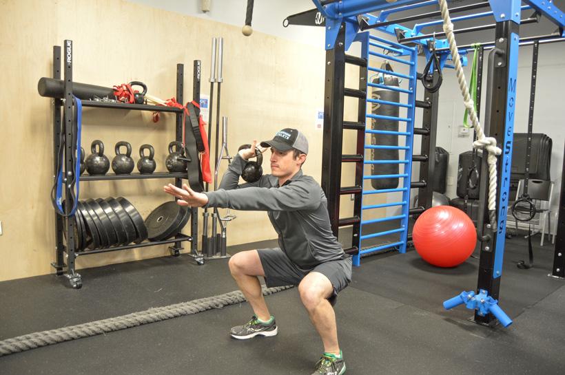 Kettlebell swing and squat workout for hunting