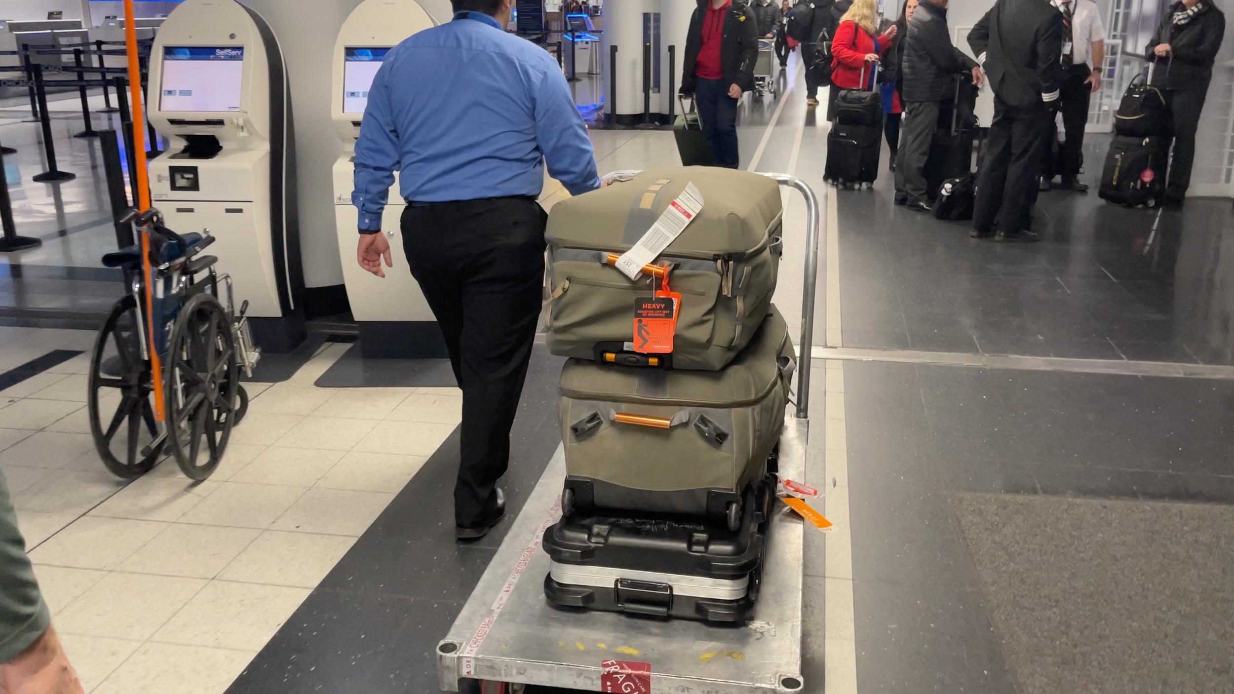 Rifle getting taken back to security room for scanning at airport