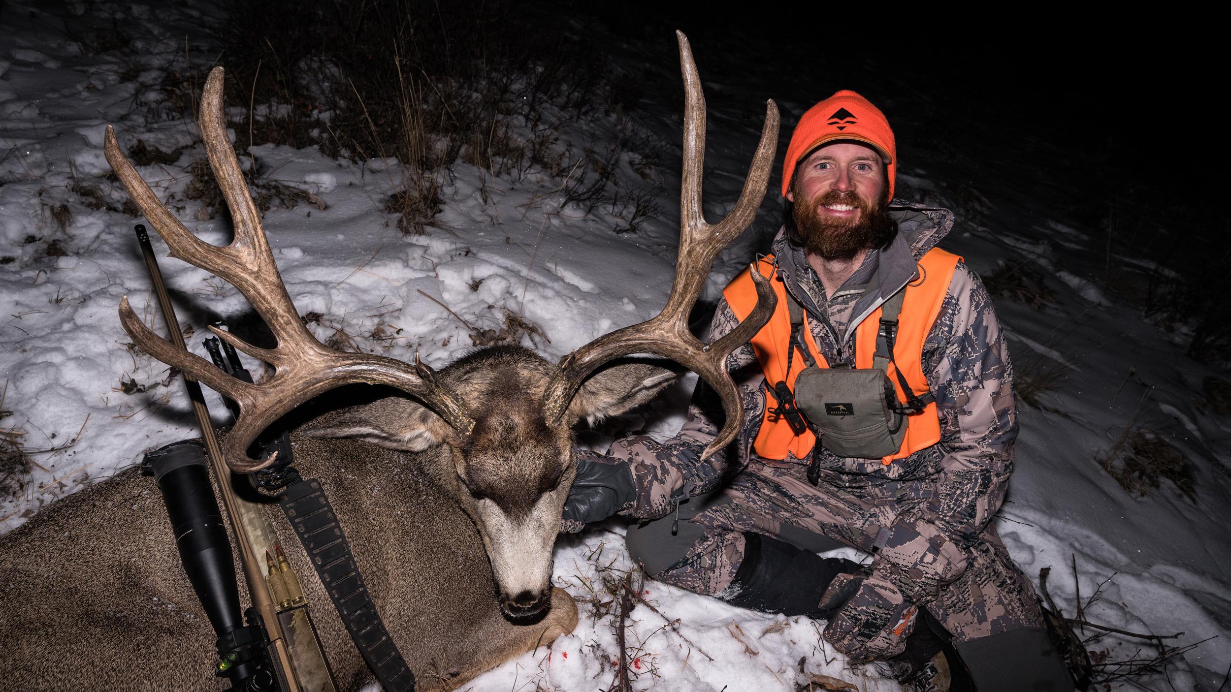 Brady Miller with his giant 204 inch mule deer on a late season hunt
