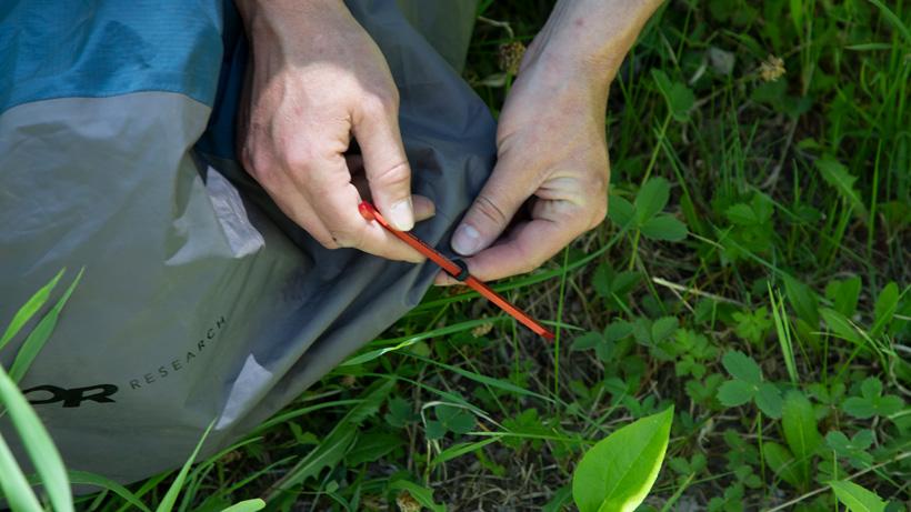 Staking down a bivy sack for windy conditions